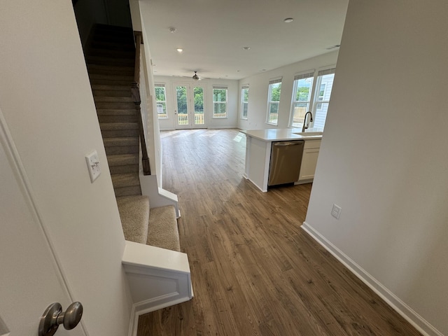 410 Blair Rd, Smyrna, TN 37167 - hall featuring stairs, baseboards, wood finished floors, a sink, and recessed lighting