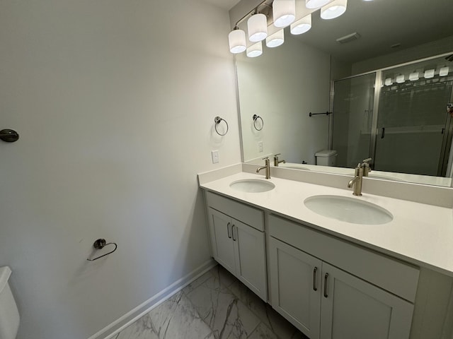 410 Blair Rd, Smyrna, TN 37167 - bathroom with toilet, baseboards, marble finish flooring, double vanity, and a shower stall