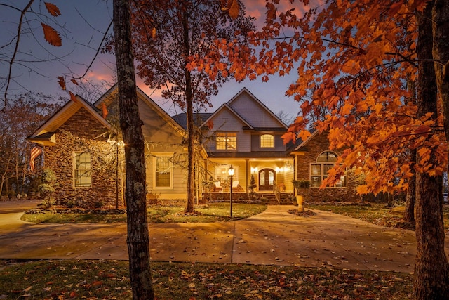 697 N Stewart Ln, Rising Fawn, GA 30738 - traditional-style home with a porch and stone siding