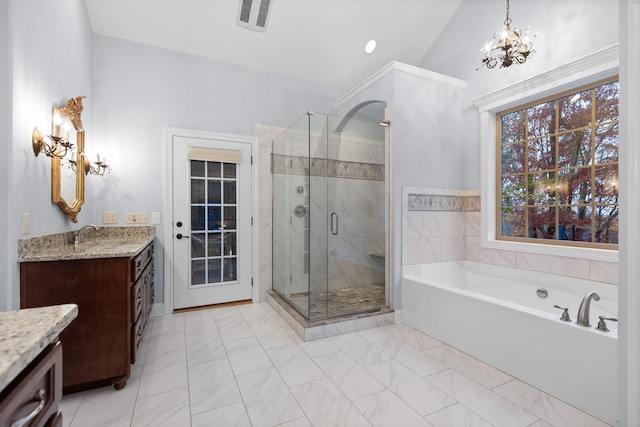 697 N Stewart Ln, Rising Fawn, GA 30738 - full bathroom featuring vanity, a garden tub, a stall shower, a chandelier, and lofted ceiling