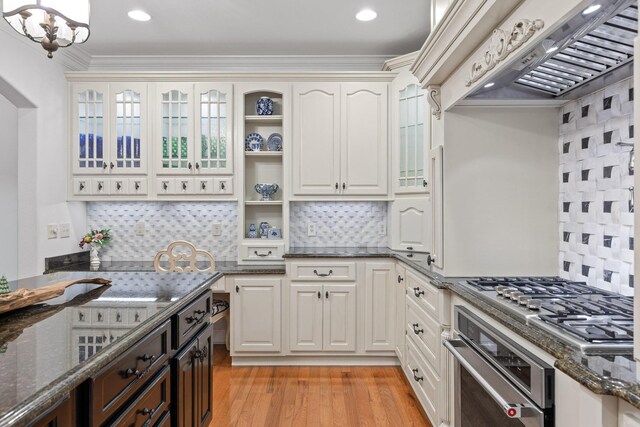 697 N Stewart Ln, Rising Fawn, GA 30738 - kitchen with stainless steel appliances, custom exhaust hood, backsplash, dark stone countertops, and ornamental molding