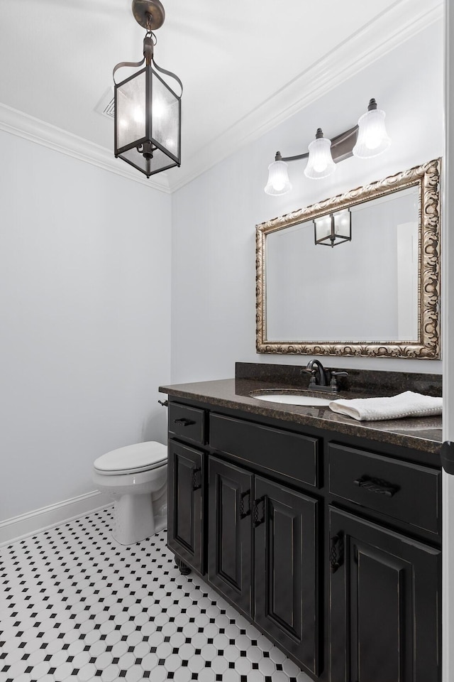 697 N Stewart Ln, Rising Fawn, GA 30738 - bathroom with ornamental molding, vanity, toilet, baseboards, and tile patterned flooring