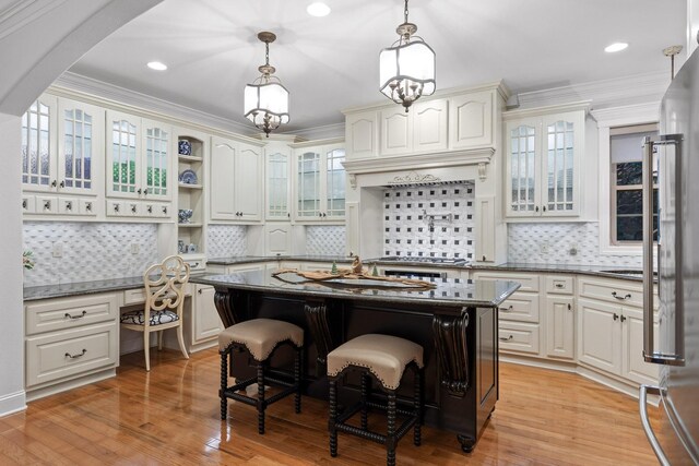 697 N Stewart Ln, Rising Fawn, GA 30738 - kitchen featuring a breakfast bar, decorative backsplash, decorative light fixtures, open shelves, and crown molding
