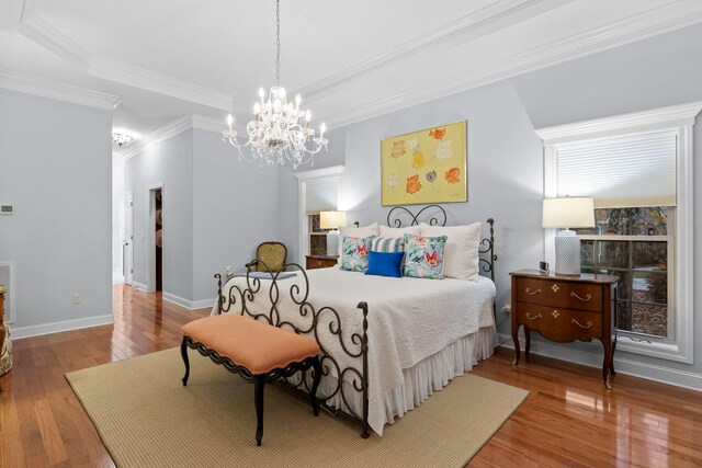 697 N Stewart Ln, Rising Fawn, GA 30738 - bedroom with wood-type flooring, a chandelier, ornamental molding, and baseboards
