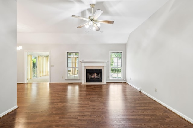 4348 Oakcrest Ln, Hermitage, TN 37076 - unfurnished living room featuring ceiling fan, a fireplace with flush hearth, wood finished floors, baseboards, and vaulted ceiling