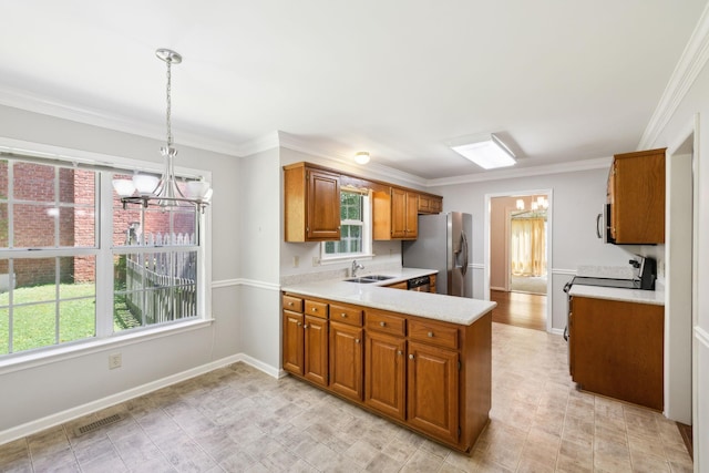 4348 Oakcrest Ln, Hermitage, TN 37076 - kitchen featuring a chandelier, a sink, stainless steel appliances, light countertops, and crown molding