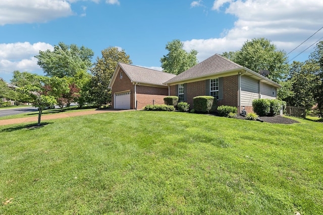 4348 Oakcrest Ln, Hermitage, TN 37076 - view of front facade featuring brick siding, a front yard, a garage, and driveway