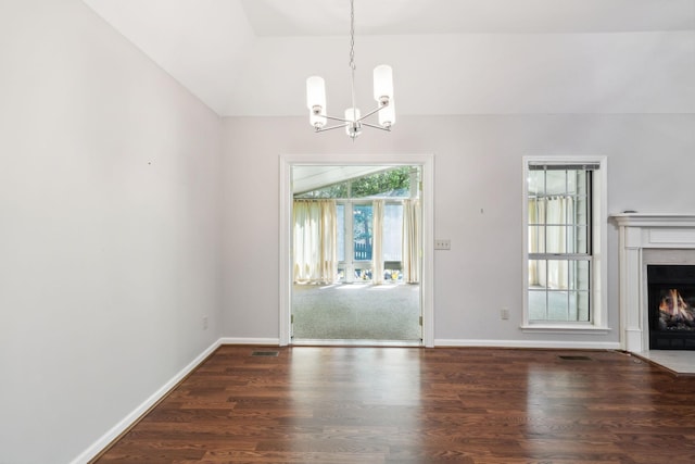 4348 Oakcrest Ln, Hermitage, TN 37076 - unfurnished dining area featuring a chandelier, lofted ceiling, wood finished floors, a fireplace with flush hearth, and baseboards
