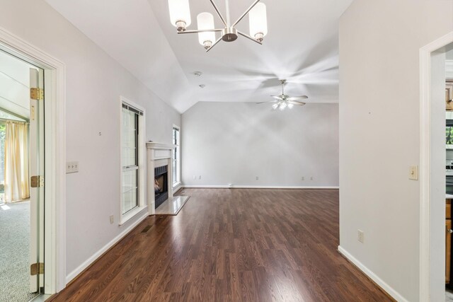 4348 Oakcrest Ln, Hermitage, TN 37076 - unfurnished living room featuring lofted ceiling, a ceiling fan, dark wood-style floors, a chandelier, and a premium fireplace