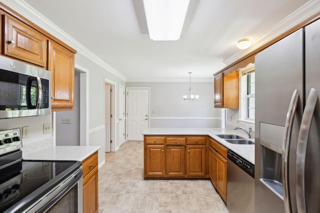 4348 Oakcrest Ln, Hermitage, TN 37076 - kitchen featuring stainless steel appliances, brown cabinets, a chandelier, and crown molding