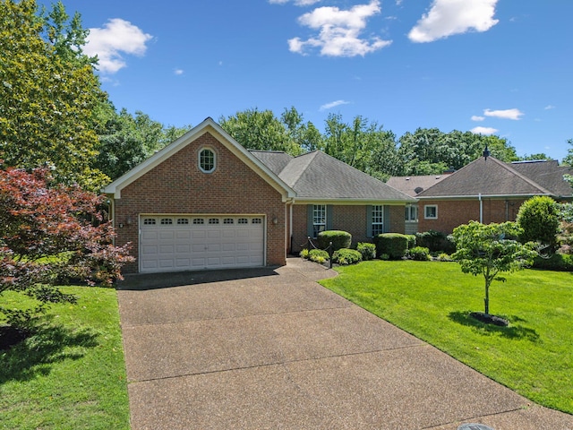 4348 Oakcrest Ln, Hermitage, TN 37076 - view of front of property with brick siding, a garage, driveway, and a front yard