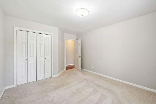4348 Oakcrest Ln, Hermitage, TN 37076 - unfurnished bedroom with light colored carpet, a closet, and baseboards