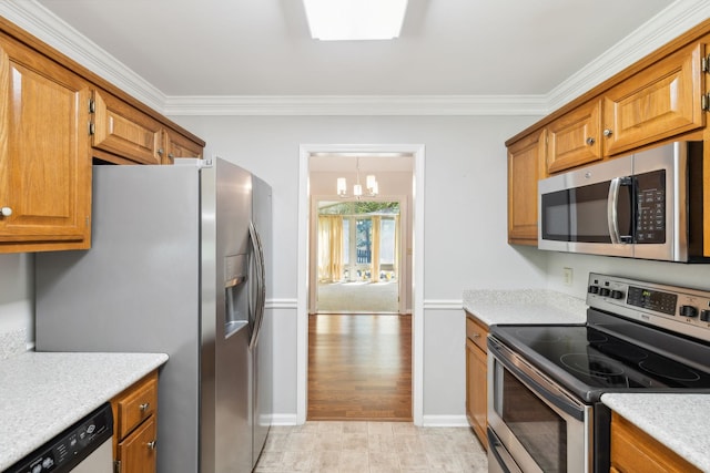 4348 Oakcrest Ln, Hermitage, TN 37076 - kitchen with appliances with stainless steel finishes, crown molding, a chandelier, light countertops, and brown cabinets