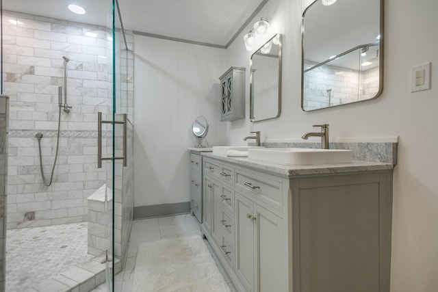 712 W Main St, Franklin, TN 37064 - bathroom with marble look tile flooring, a stall shower, double vanity, and baseboards