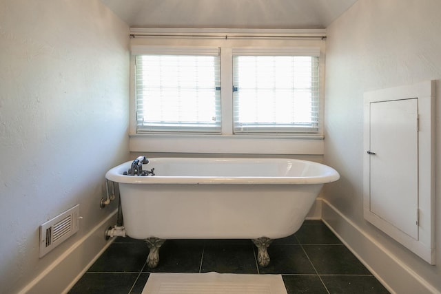 712 W Main St, Franklin, TN 37064 - bathroom with tile patterned flooring, baseboards, and a freestanding bath