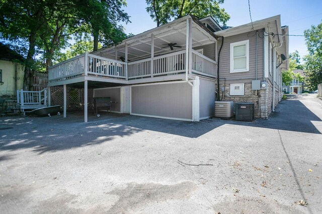712 W Main St, Franklin, TN 37064 - rear view of house with ceiling fan, central AC unit, a deck, and asphalt driveway