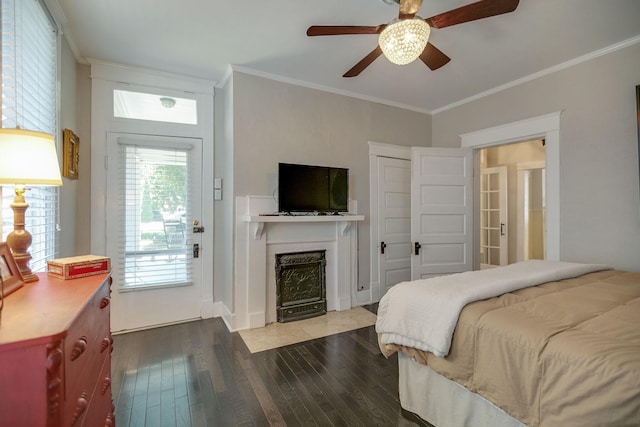 712 W Main St, Franklin, TN 37064 - bedroom featuring crown molding, dark wood-type flooring, a fireplace, and a ceiling fan
