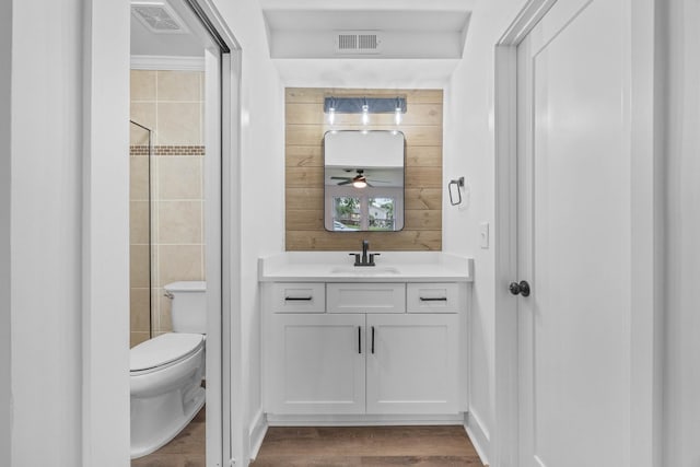 176 Kirby Dr, Clarksville, TN 37042 - bathroom with toilet, vanity, a ceiling fan, and wood finished floors