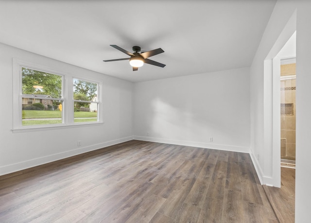 176 Kirby Dr, Clarksville, TN 37042 - spare room featuring wood finished floors, ceiling fan, and baseboards