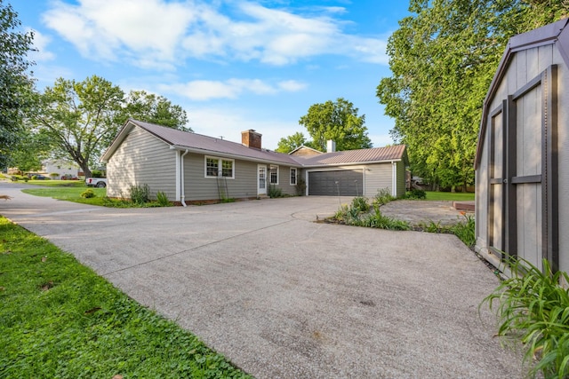 176 Kirby Dr, Clarksville, TN 37042 - ranch-style home featuring a chimney, a garage, and metal roof