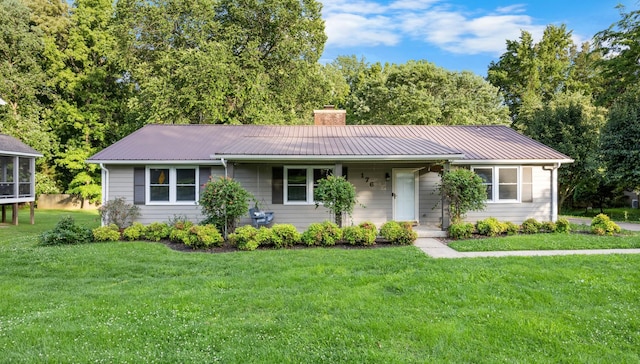 176 Kirby Dr, Clarksville, TN 37042 - ranch-style home with a chimney, a front lawn, metal roof, and a porch