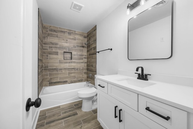 176 Kirby Dr, Clarksville, TN 37042 - bathroom featuring vanity, wood finish floors, toilet, and bathtub / shower combination