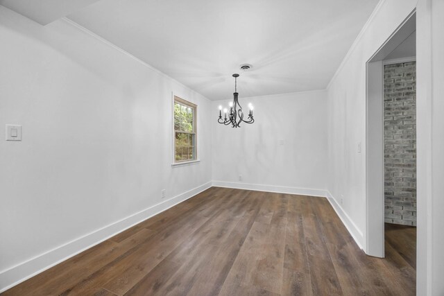 176 Kirby Dr, Clarksville, TN 37042 - unfurnished dining area with dark wood finished floors, a chandelier, crown molding, and baseboards