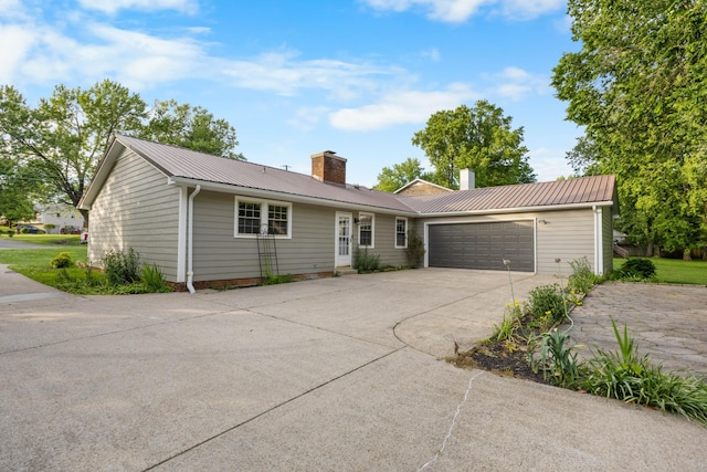 176 Kirby Dr, Clarksville, TN 37042 - ranch-style home featuring a chimney, an attached garage, concrete driveway, and metal roof