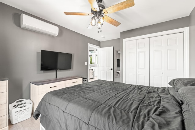 14 Lewter Rd, Taft, TN 38488 - bedroom featuring an AC wall unit, wood finished floors, a closet, and a ceiling fan