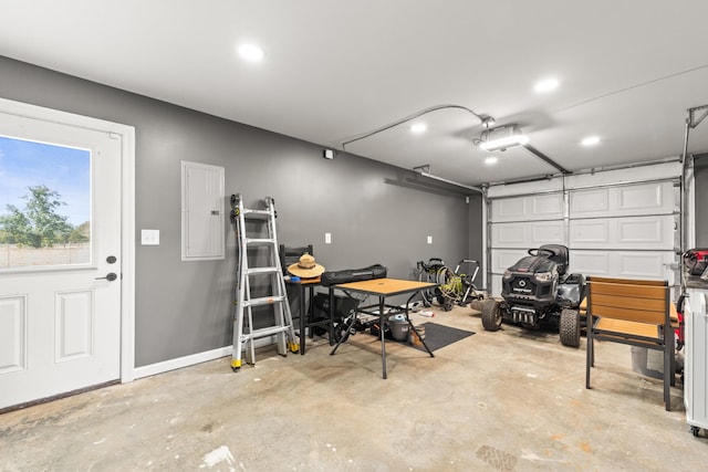 14 Lewter Rd, Taft, TN 38488 - garage featuring electric panel, a garage door opener, and recessed lighting