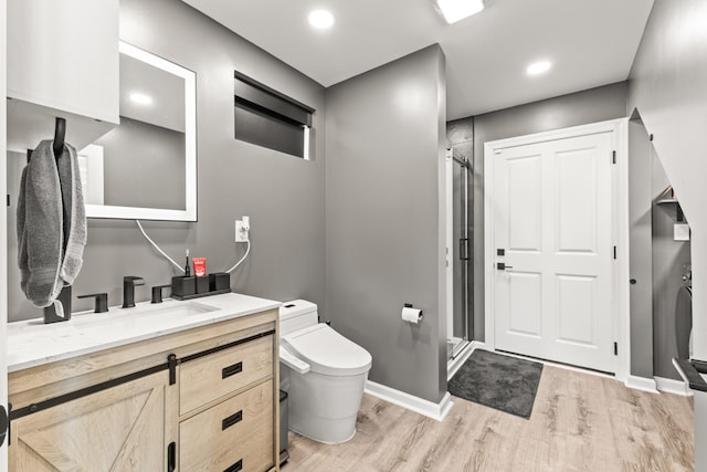 14 Lewter Rd, Taft, TN 38488 - bathroom with wood finished floors, toilet, a stall shower, and vanity