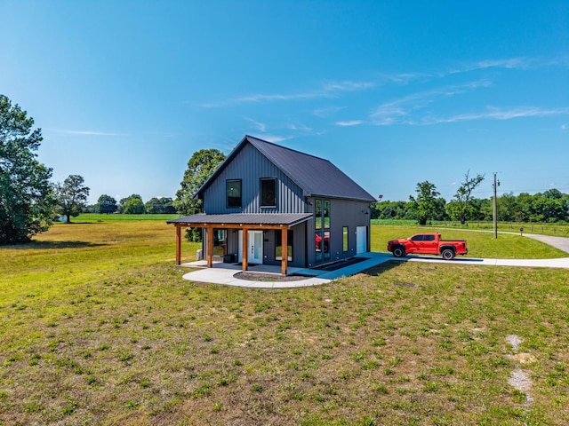 14 Lewter Rd, Taft, TN 38488 - view of front of house featuring metal roof and a front lawn