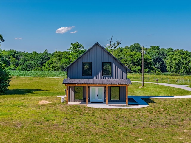 14 Lewter Rd, Taft, TN 38488 - view of front of home with french doors, board and batten siding, and metal roof