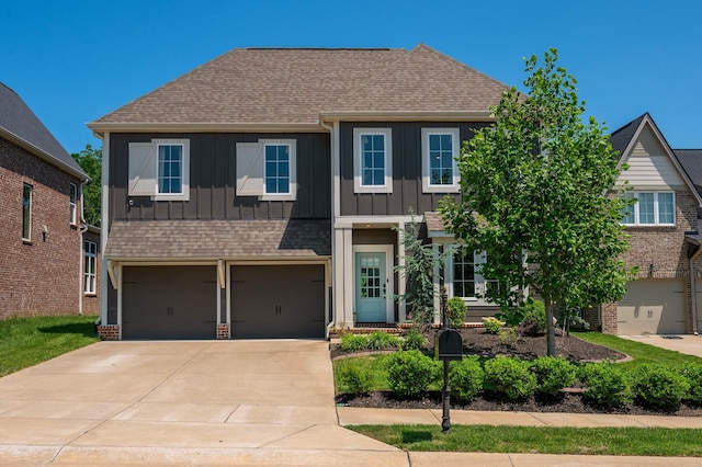 894 Plowson Rd, Mount Juliet, TN 37122 - view of front of property with board and batten siding, concrete driveway, a shingled roof, and a garage