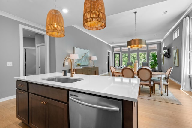 894 Plowson Rd, Mount Juliet, TN 37122 - kitchen with dishwasher, a sink, light wood-style floors, light countertops, and decorative light fixtures