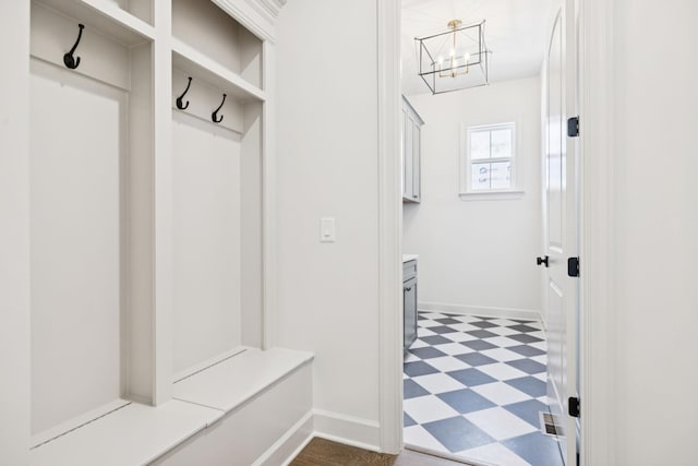 1001 Laguna Dr, Franklin, TN 37067 - mudroom with tile patterned floors and a chandelier