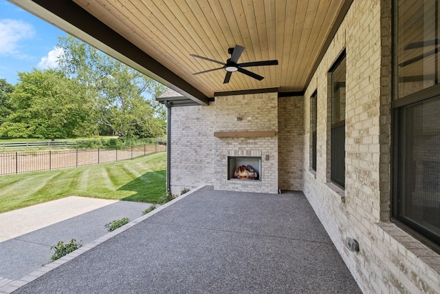 1001 Laguna Dr, Franklin, TN 37067 - view of patio / terrace with an outdoor brick fireplace and a ceiling fan