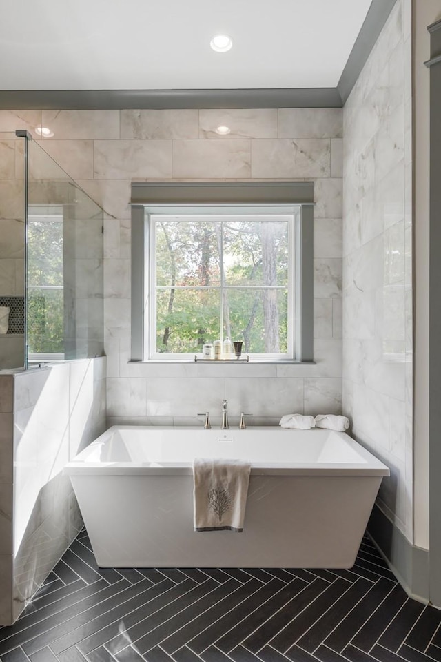 9906 Amarosa Ct, Brentwood, TN 37027 - bathroom featuring tile walls, a freestanding bath, and tile patterned flooring