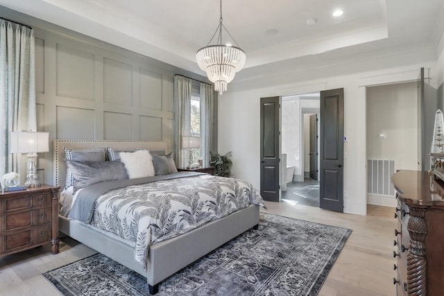 9906 Amarosa Ct, Brentwood, TN 37027 - bedroom with a chandelier, a raised ceiling, light wood-type flooring, and recessed lighting