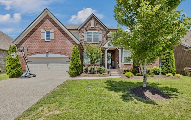 743 Burgess Dr, Goodlettsville, TN 37072 - view of front of house featuring concrete driveway, a front lawn, a garage, and brick siding