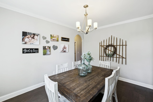 743 Burgess Dr, Goodlettsville, TN 37072 - dining room featuring arched walkways, baseboards, ornamental molding, dark wood-type flooring, and a chandelier