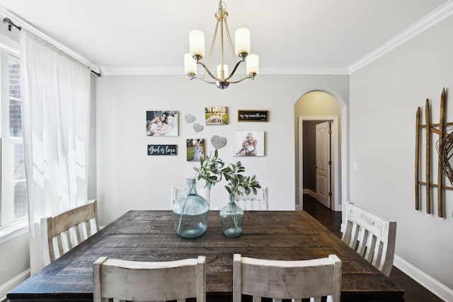 743 Burgess Dr, Goodlettsville, TN 37072 - dining room featuring arched walkways, a chandelier, crown molding, and baseboards