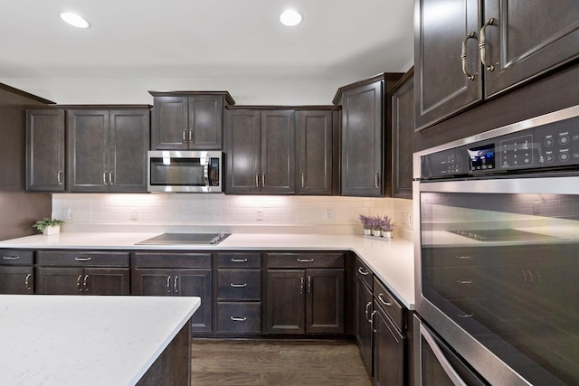 743 Burgess Dr, Goodlettsville, TN 37072 - kitchen featuring stainless steel appliances, light countertops, dark brown cabinets, backsplash, and recessed lighting