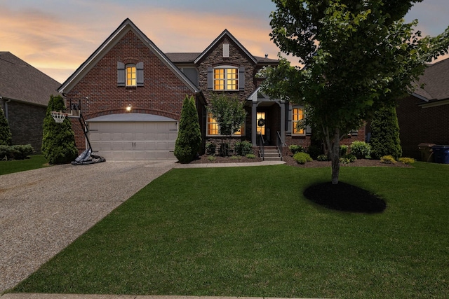 743 Burgess Dr, Goodlettsville, TN 37072 - view of front facade featuring driveway, an attached garage, a yard, and brick siding