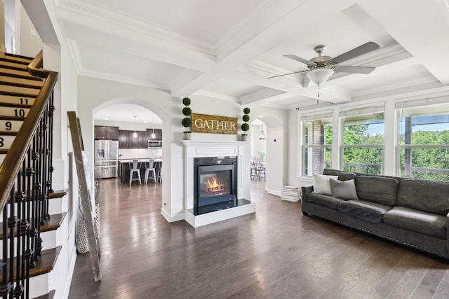 743 Burgess Dr, Goodlettsville, TN 37072 - living room with arched walkways, a ceiling fan, stairway, coffered ceiling, and healthy amount of natural light