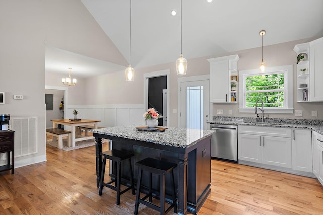 600 S Tunnel Rd, Gallatin, TN 37066 - kitchen with stainless steel dishwasher, open shelves, white cabinets, a kitchen island, and vaulted ceiling
