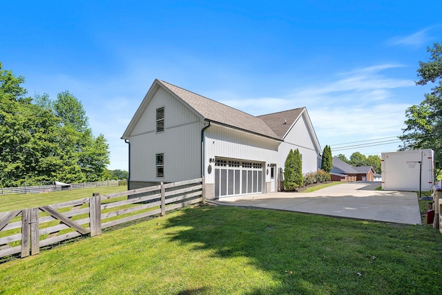 600 S Tunnel Rd, Gallatin, TN 37066 - view of side of home with driveway, an attached garage, and a shingled roof