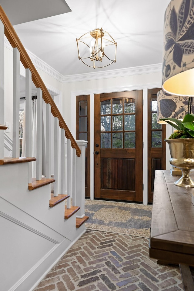 18 Whispering Pines Dr, Signal Mountain, TN 37377 - entrance foyer with stairway, brick floors, a chandelier, and crown molding