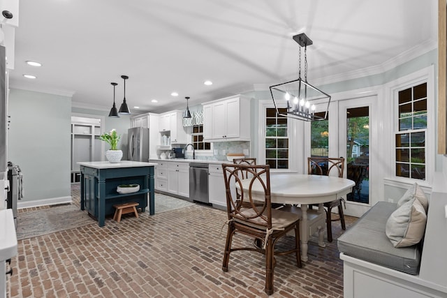 18 Whispering Pines Dr, Signal Mountain, TN 37377 - dining area featuring brick floors, recessed lighting, crown molding, a chandelier, and baseboards