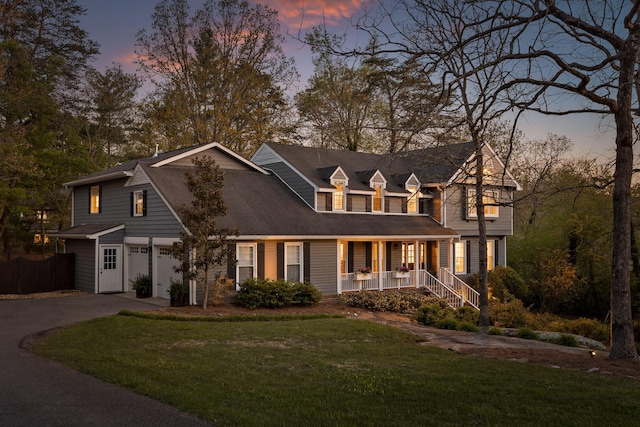 18 Whispering Pines Dr, Signal Mountain, TN 37377 - view of front facade with a porch, asphalt driveway, and a garage